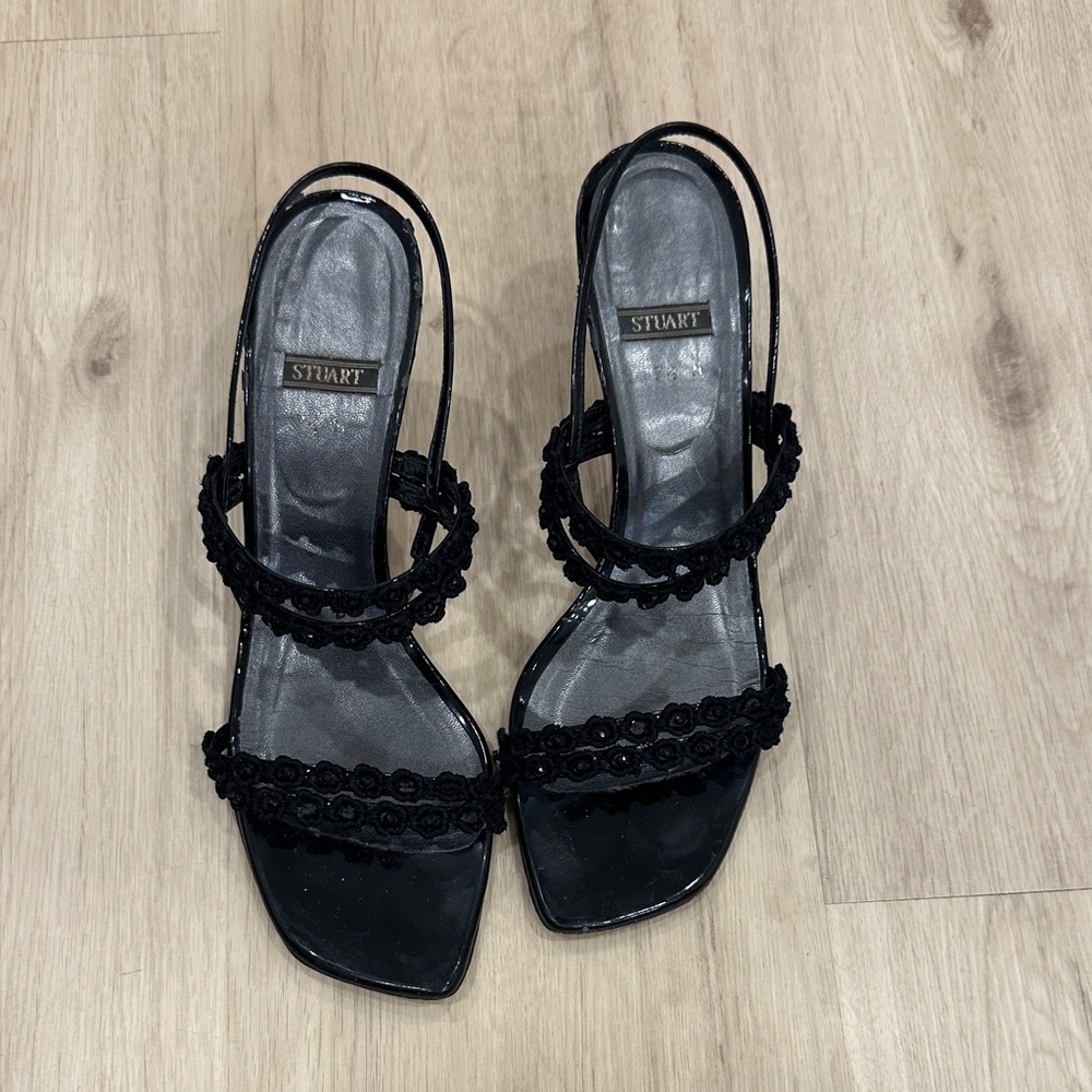 136. Stuart Weitzman Black Strappy Heels.